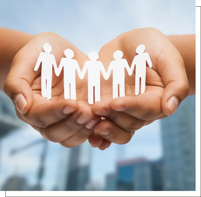 Paper people in cupped hands